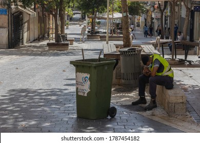 Jerusalem, Israel - July 30th, 2020: A Street Cleaner Sitting Idly On Ben - Yehuda Pedestrian Mall, Usually A Crowded Main Street Of Jerusalem, Almost Empty At COVID Times.