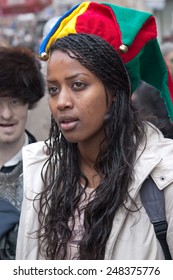 JERUSALEM, ISRAEL - MARCH 15, 2006: Purim Carnival, Portrait Of A Young Ethiopian Woman On Her Head Wearing Clown Hat With Bells. Purim Is Celebrated Annually According To The Hebrew Calendar. 