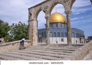 JERUSALEM, ISRAEL - MAY 05, 2015: Old muslim man, climbing the stairs leading to the Dome of the Rock, in the Temple Mount