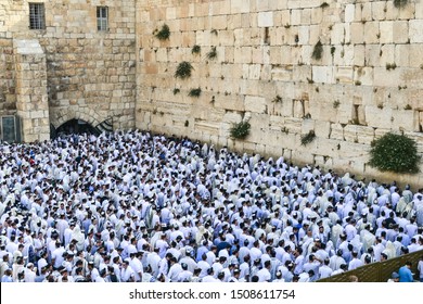Jerusalem / Israel - May 28, 2014: A crowd of Jewish men during Shabbat seen from above, all dressed up in white clothes and kippah
