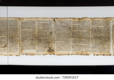 JERUSALEM, ISRAEL - OCTOBER 13, 2017: One of Dead Sea Scrolls, displayed in Shrine of the Book. Israel Museum, Jerusalem. Israel