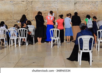 JERUSALEM, ISRAEL - OCTOBER 31, 2014: Women Praying At Female Side Of Jerusalem's Western Wall.