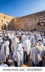 JERUSALEM, ISRAEL - SEPTEMBER 26, 2018: Morning autumn Sukkot. Blessing of the Kohanim. Thousands of Jews, wrapped in tallits, pray at the Western  Wall. Religious tourism concept