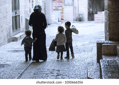Jerusalem / Israel-3 March 2018: Jewish family in the old street in the Jewish quarter of Jerusalem
