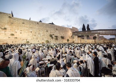 JERUSALEM - OCTOBER 14, 2014: Religious Jews sunrise prayer service at the Western Wall, Israel