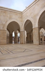 Jerusalem / Palestine - February 18th 2014:  of King Hussain Bin Talal Mosque in Amman, Jordan. Stunning white stoned prayer hall and courtyard with arched pillars.