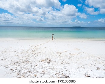Jervis Bay JBT Australia - February 14th 2021 - Iluka Beach With Blue Water And A Pre School Girl Playing On The Sand On A Sunny Summer Afternoon