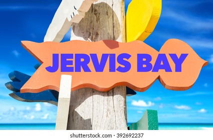 Jervis Bay signpost with beach background