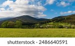 Jesenik town, Bela river valley and hills of Zlatohorska vrchovina mountains with Zlaty chlum hill from Tocnik hill in Jeseniky mountains in Czech republic