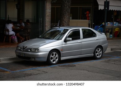 JESOLO, ITALY - AUGUST 26, 2013: Alfa Romeo 146 Classic Italian Fast Small Family 1990s Car On The Street