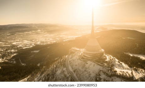 Jested mountain with modern hotel and TV transmitter on the top, Liberec, Czech Republic. Sunny winter day with snowy landscape. Aerial view from drone. - Powered by Shutterstock