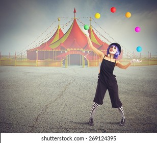 Jester Clown In Front Of Circus Tent