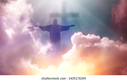 Jesus appeared bright in the sky and Christian Cross with soft fluffy clouds, white and beautiful with the light shining as hope, love and freedom in the sky background.