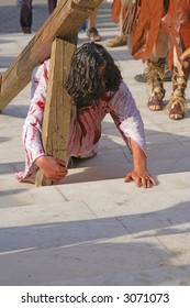 Jesus carrying the cross - aspect from a religious street show.