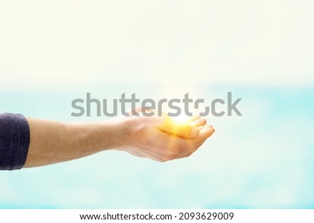 Jesus Christ near water outdoors, Miraculous light in hand