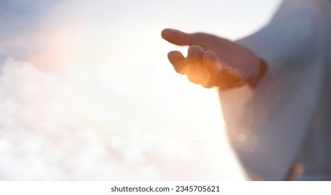Jesus Christ with open arms reaching out in the sky, hand gestures of Jesus dying on the cross and resurrected, heaven and salvation, faith and love, easter concept

