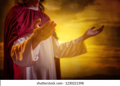 Jesus christ raising hands and praying with sunset background - Shutterstock ID 1230221398