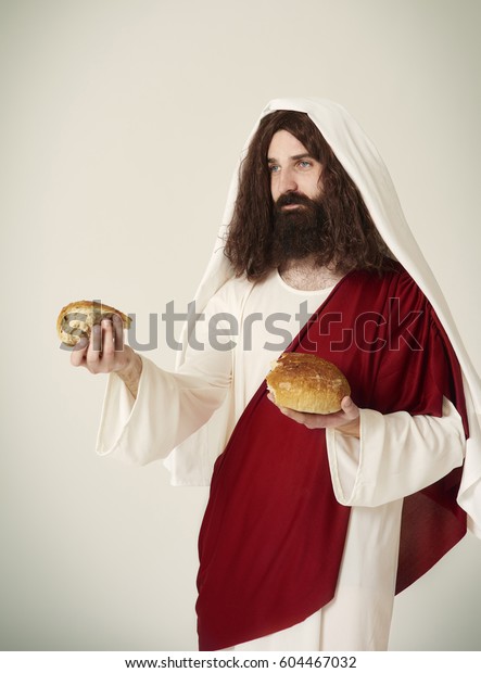 Jesus divided  bread into\
pieces 