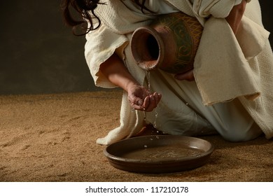 Jesus pouring water from a jug