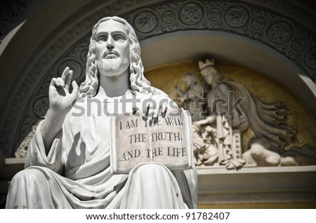 Jesus statue with the quote book