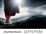Jesus walks on water across the sea towards a boat during a storm. Biblical theme concept.