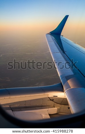 Jet Aircraft Winglet (Wingtip) and Engine after take off from Amsterdam Shiphol Airport (North Holland, The Netherlands).