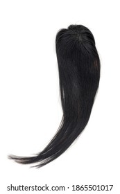 A Jet Black Wig Or Hair Topper On A White Background.