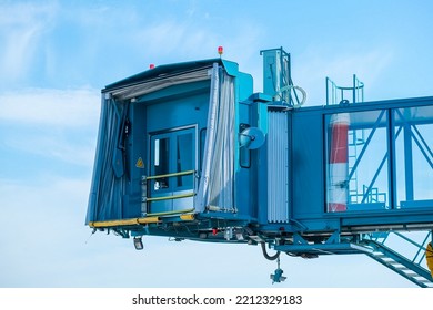 Jet Bridge At The Airport Is Brought To A Large Passenger Plane For Passengers To Exit