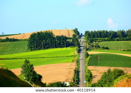 the Jet coaster road and patchwork farms at Hokkaido, Japan