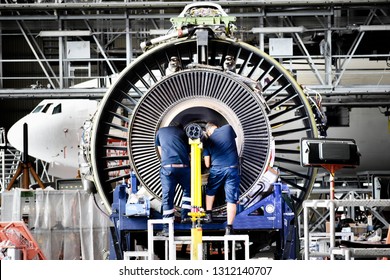 Jet engine remove from aircraft (airplane) for maintenance at aircraft hangar.Jet engine maintenance and change part by aircraft technician . - Powered by Shutterstock