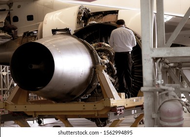 Jet engine remove from aircraft (airplane) for maintenance at aircraft hangar.Jet engine maintenance and change part by aircraft technician .