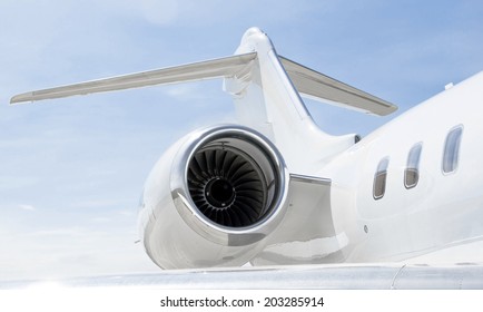 Jet Engine With A Tail And Part Of A Wing On A Luxury Private Jet Plane