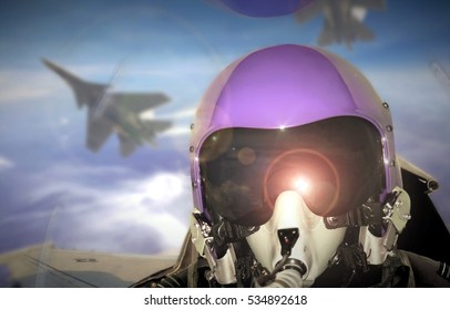 Jet fighter pilot cockpit view during sunrise