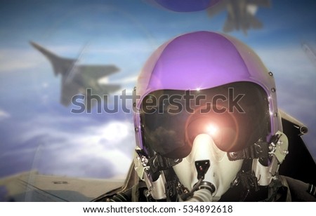 Jet fighter pilot cockpit view during sunrise