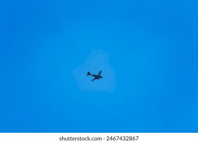 A jet fighter soars through a clear blue sky with wisps of clouds.
Keywords: jet fighter, blue sky, clouds, aviation, flight