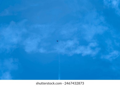 A jet fighter soars through a clear blue sky with wisps of clouds.
Keywords: jet fighter, blue sky, clouds, aviation, flight