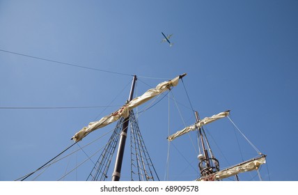 Jet Pane And An Old Sailing Ship Against A Summer Blue Sky - Croatia.