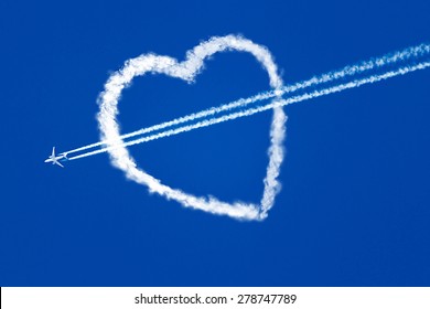 Jet Plane In The Blue Sky, And A Trace Of Turbines, Flies Through The Heart