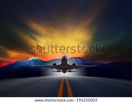 jet plane flying over runways against rock mountain and beautiful dusky sky with copy space use for air transport ,journey and traveling industry business 