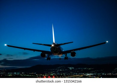 Jet Plane Landing Scene At Dusk.