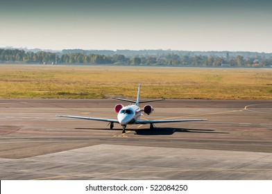 Jet Plane Parking At The Airport. Small Private Airplane At The Airport Parking.