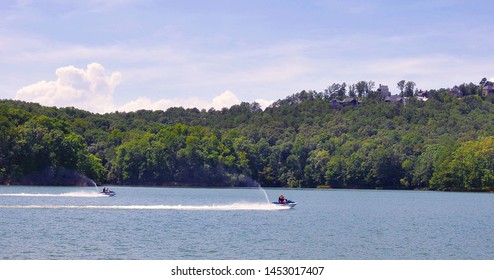 Jet Ski Racing on a Mountain Lake in Summer - Powered by Shutterstock