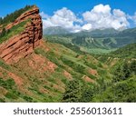 The Jeti-Oguz Mountains in Kyrgyzstan are known for their red rocks and picturesque landscapes. Unique formations such as the "Seven Bulls" make this place a popular tourist attraction.