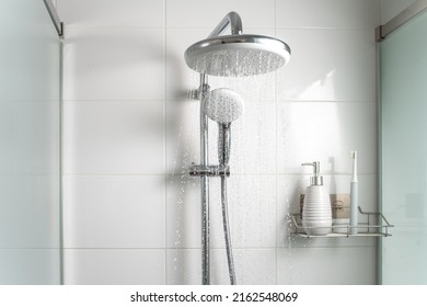 Jets of clean water flowing in the shower cabin. Selective focus. - Shutterstock ID 2162548069
