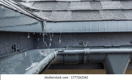 Jets Of Rain Drain Into The Drainage System On The Roof Of The House