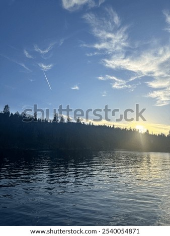 Jetstream and sunset over lake