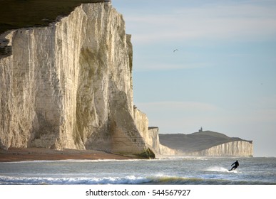 Jetsurfer in the sea at the base of the Chalk cliffs of the Seven Sisters