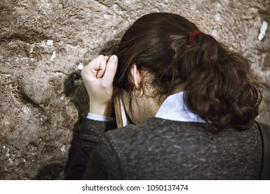 The Jew Woman Prays Near The Western Wall / Kotel In The Old City Of Jerusalem, Israel