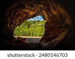 Jewel Cave National Monument Historic Site with outside hill view: The Beautiful Rock Formation and Opening at Custer State Park, Black Hills Country, South Dakota