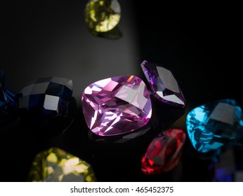 Jewel or gems on black shine color, Collection of many different natural gemstones 
amethyst, lapis lazuli, rose quartz, citrine, ruby, amazonite, moonstone, labradorite, chalcedony, blue topaz